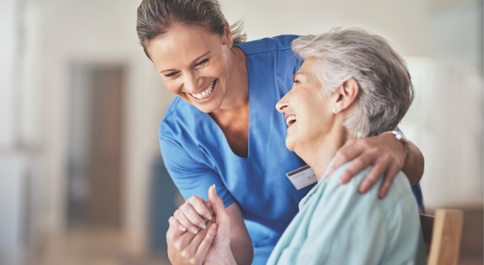 nurse caring for patient in her home at heritage community of kalamazoo