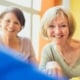 two woman laughing and smiling