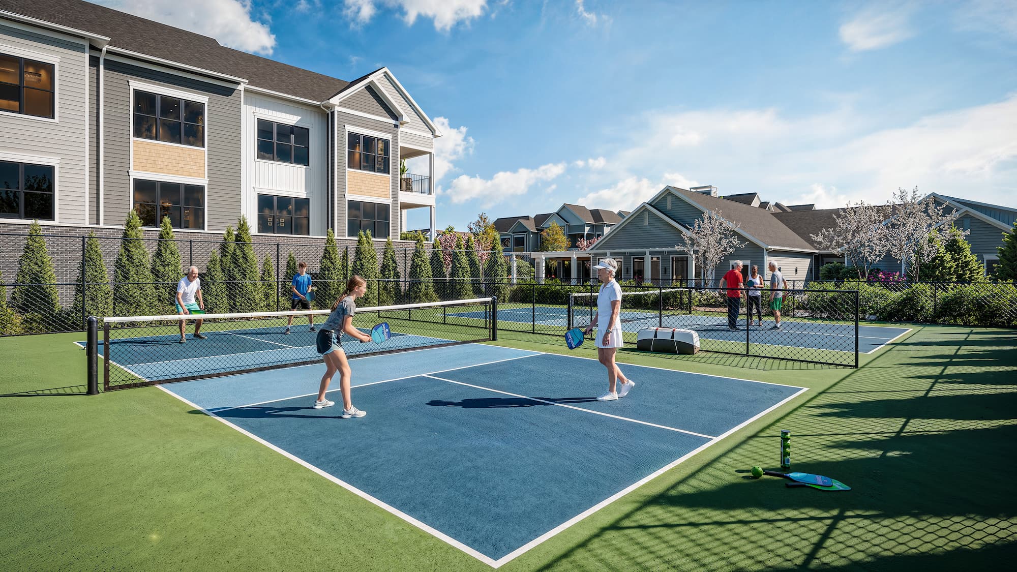 a rendering of the on-site pickleball courts wiith residents playing games