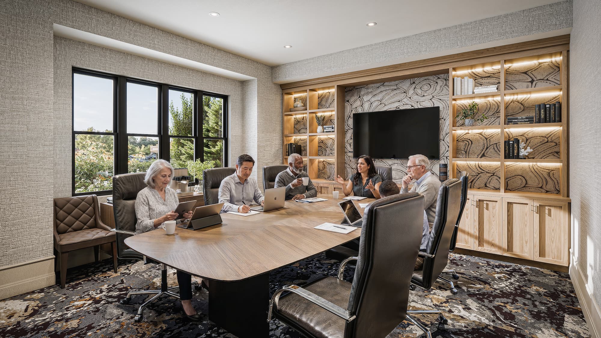 a rendering of the conference room with a large meeting table with multiple residents attending