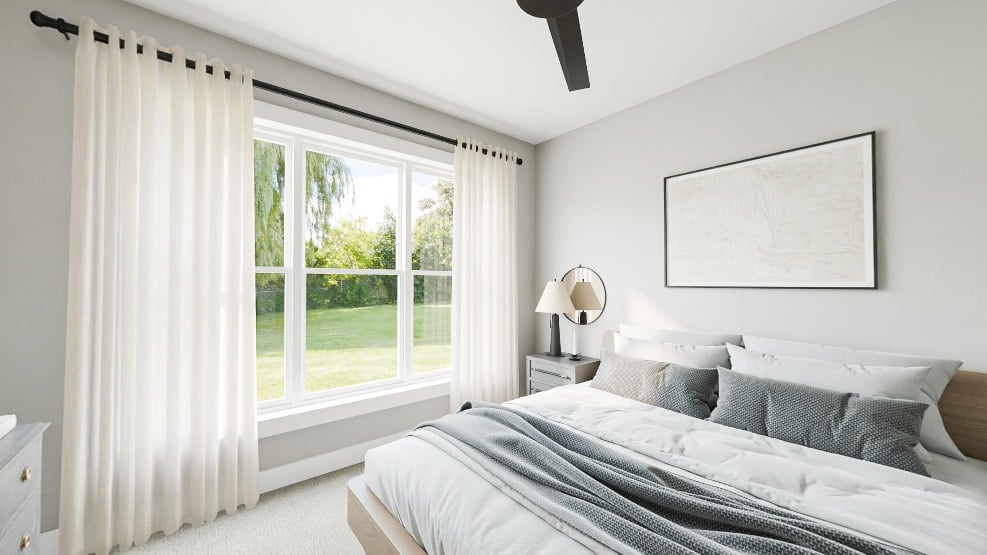 _bedroom a rendering of a bedroom at the Halstead, fully furnished wiht a bed and nightstand with an open window to a grassy yard